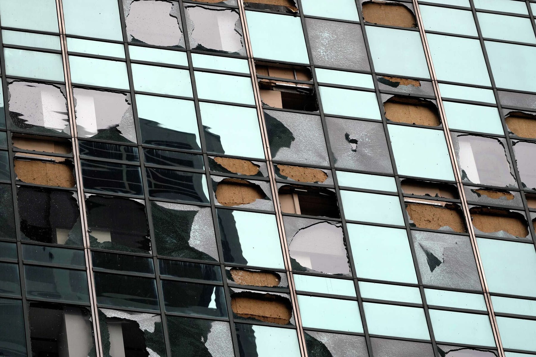 Houston high-rise with extensive broken windows after Hurricane Beryl